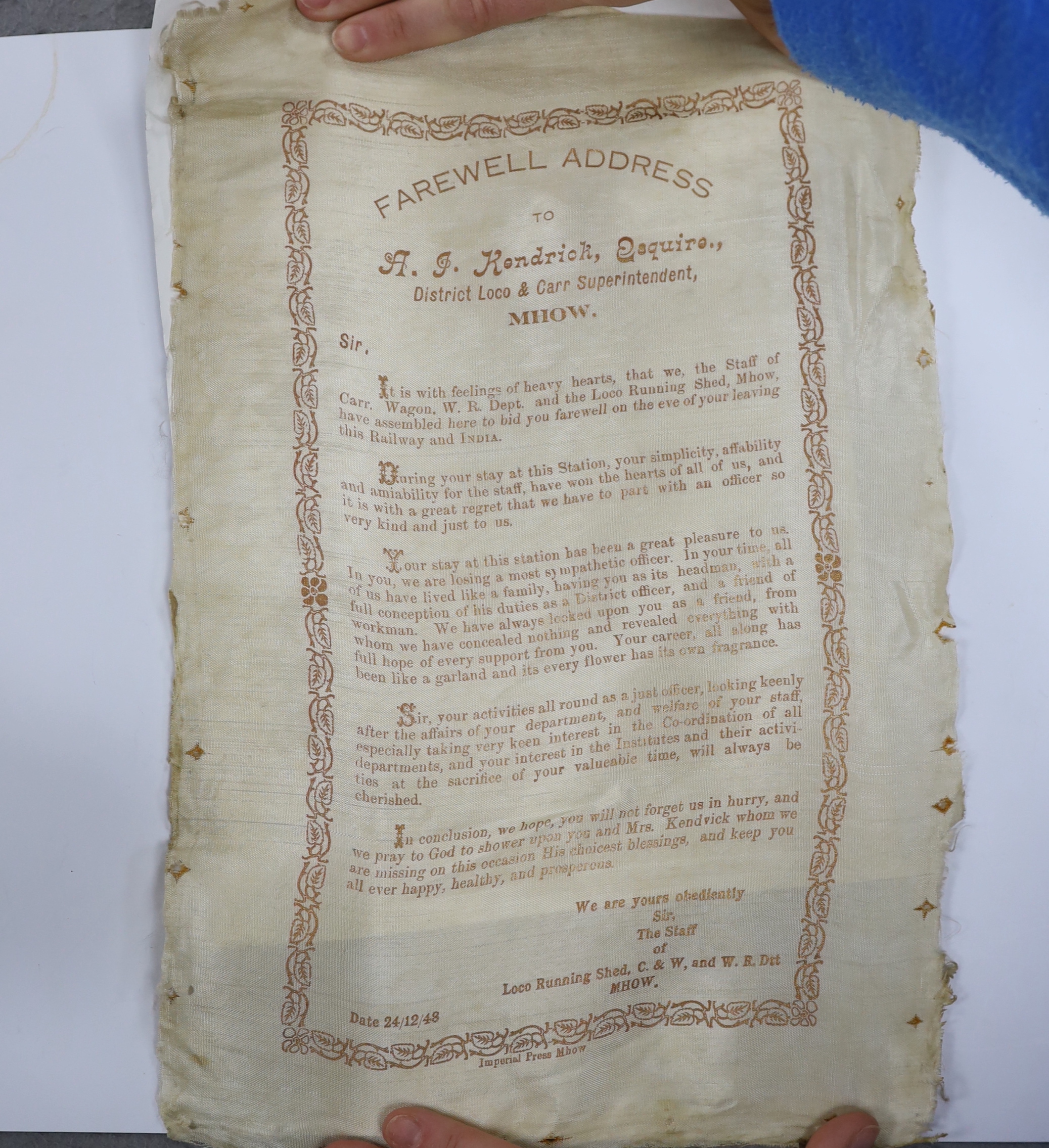 A mid 20th century Indian pierced white metal presentation scroll case to 'To A.J. Kendrick Esq. President Railway Institute Bandra, From The Members', 31.7cm, containing a silk scroll dedicated to the recipient